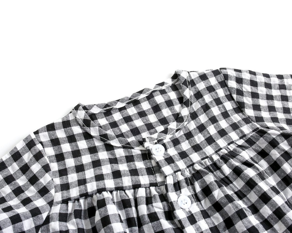 Black and white checkered fabric with a close-up view on a white background