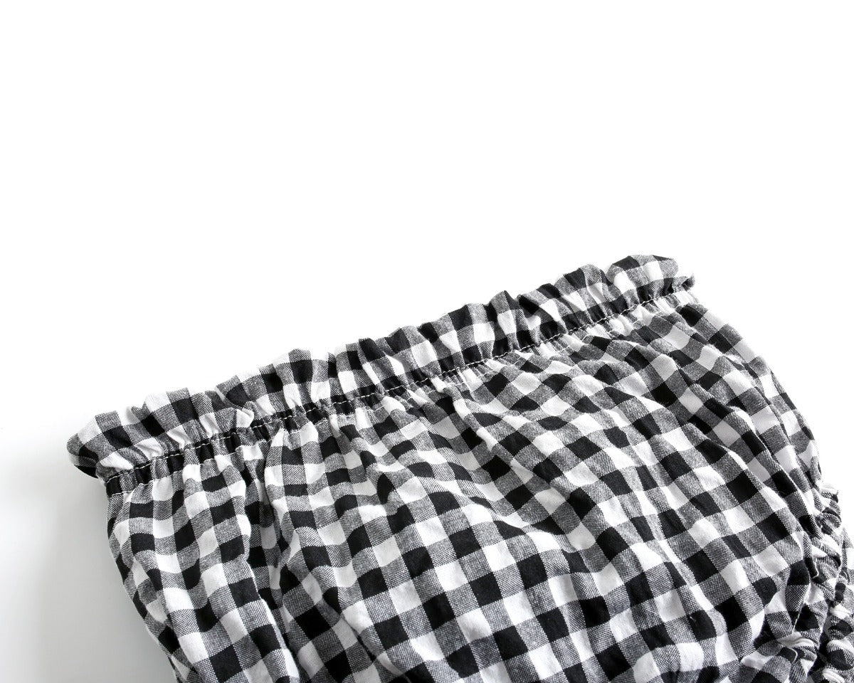 Black and white checkered bloomers on a light gray background