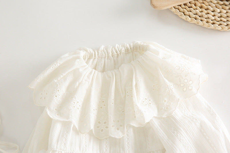 White lace petticoat on a light wooden surface