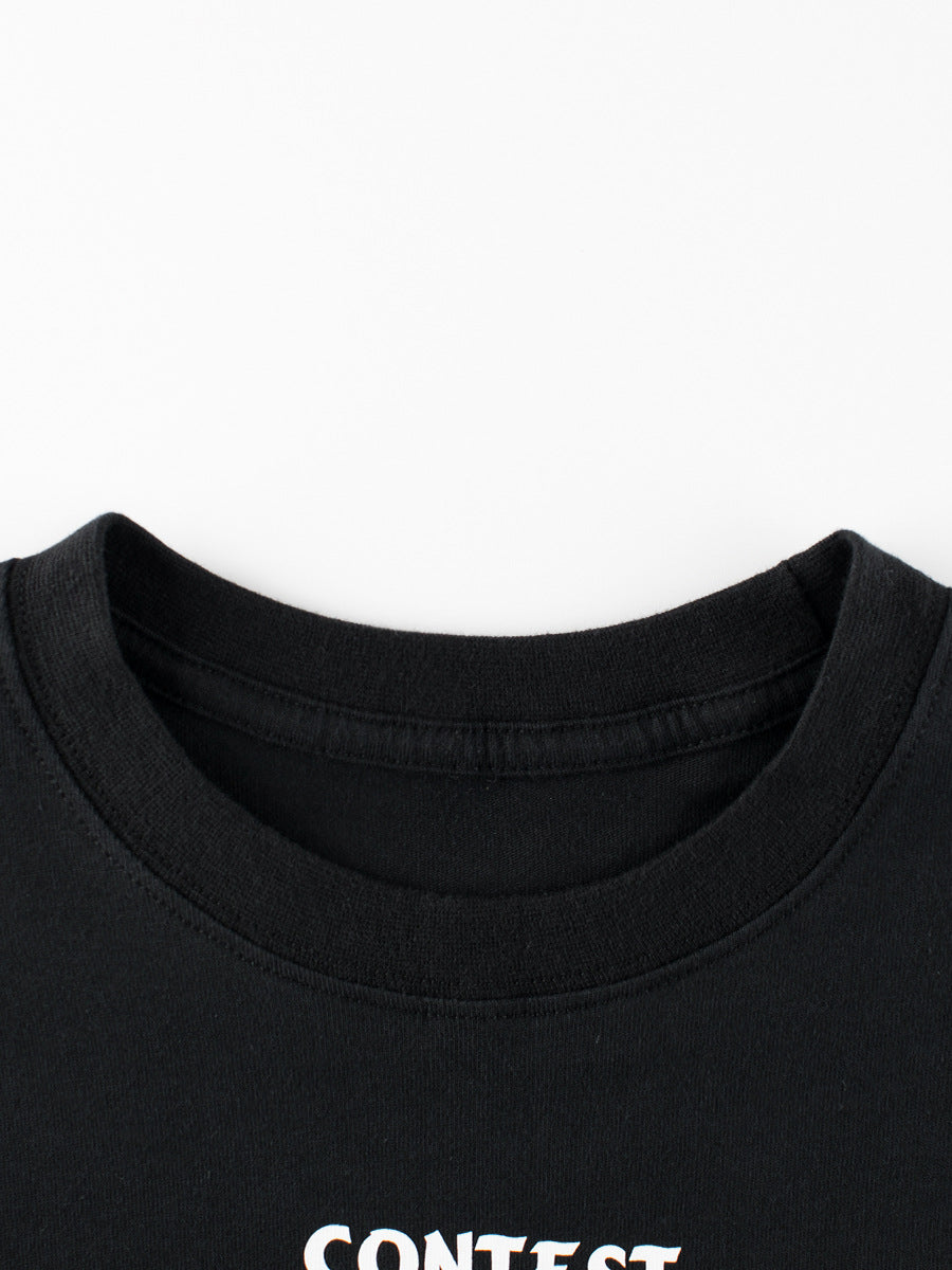 Close-up of a black shirt with 'CONTEST' text on a white background