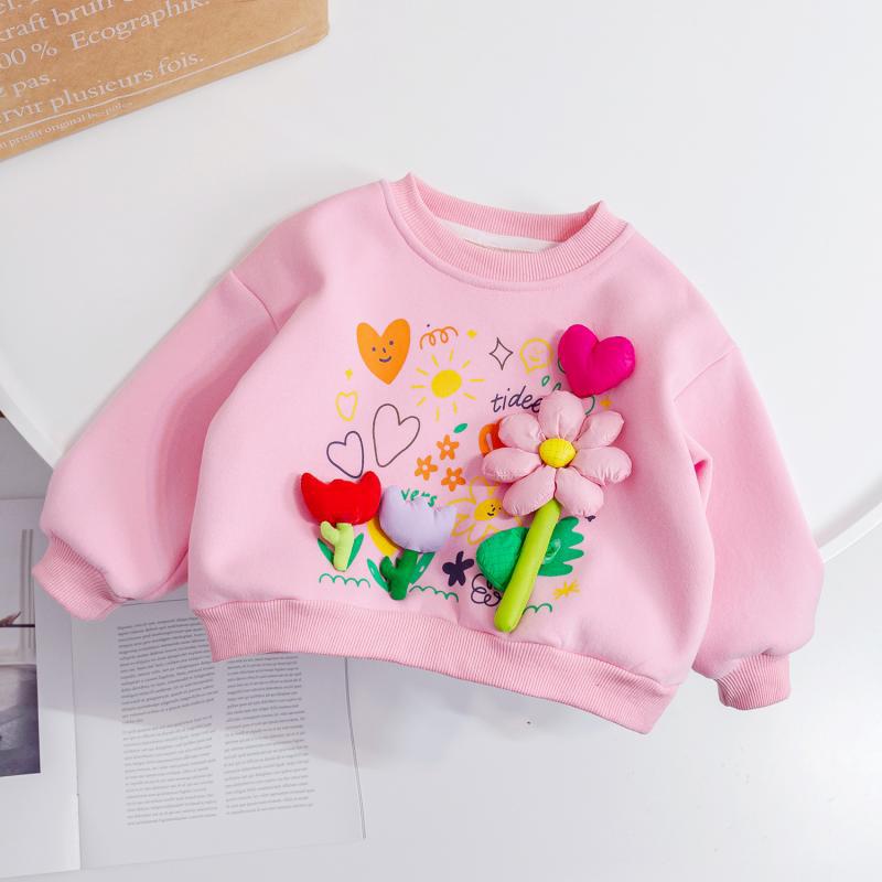 Pink children's sweatshirt with colorful floral designs on a white background