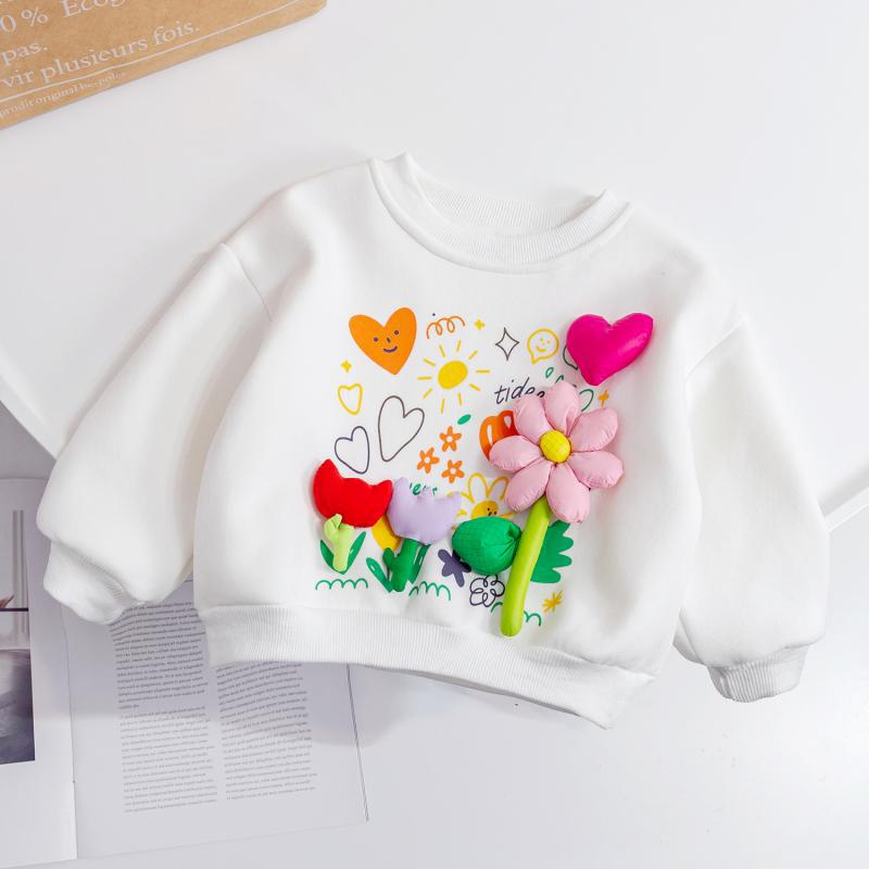 White sweatshirt with colorful floral and heart designs on a white background