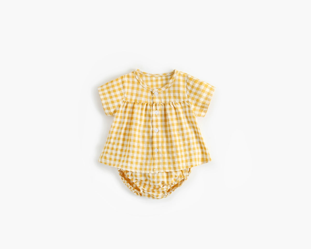 Yellow gingham baby romper on a white background