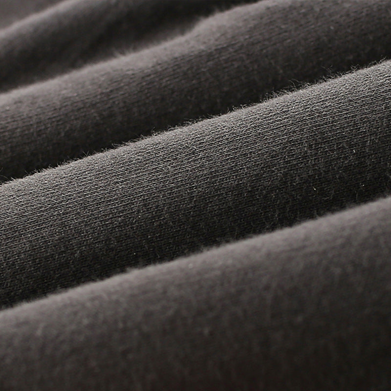 Close-up of dark gray fabric with a textured surface