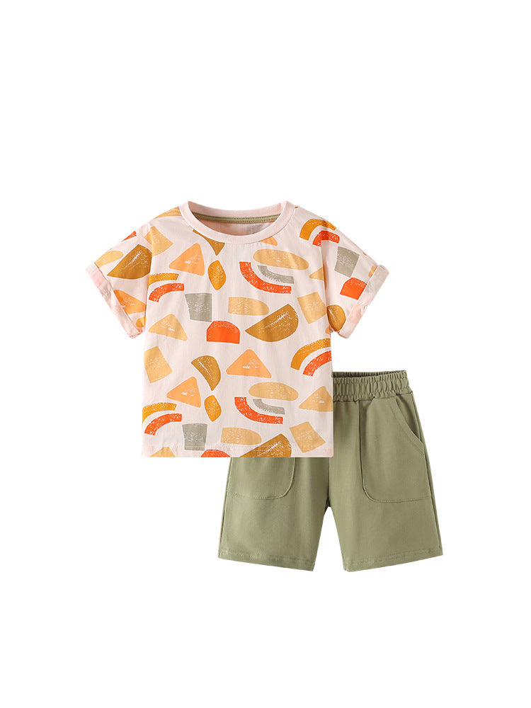 Children's outfit with a patterned shirt and green shorts on a white background