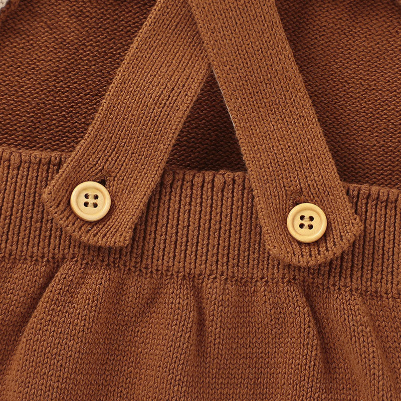 Close-up of a brown knitted garment with button details