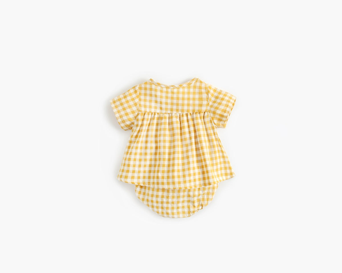 Yellow checkered baby romper on a white background
