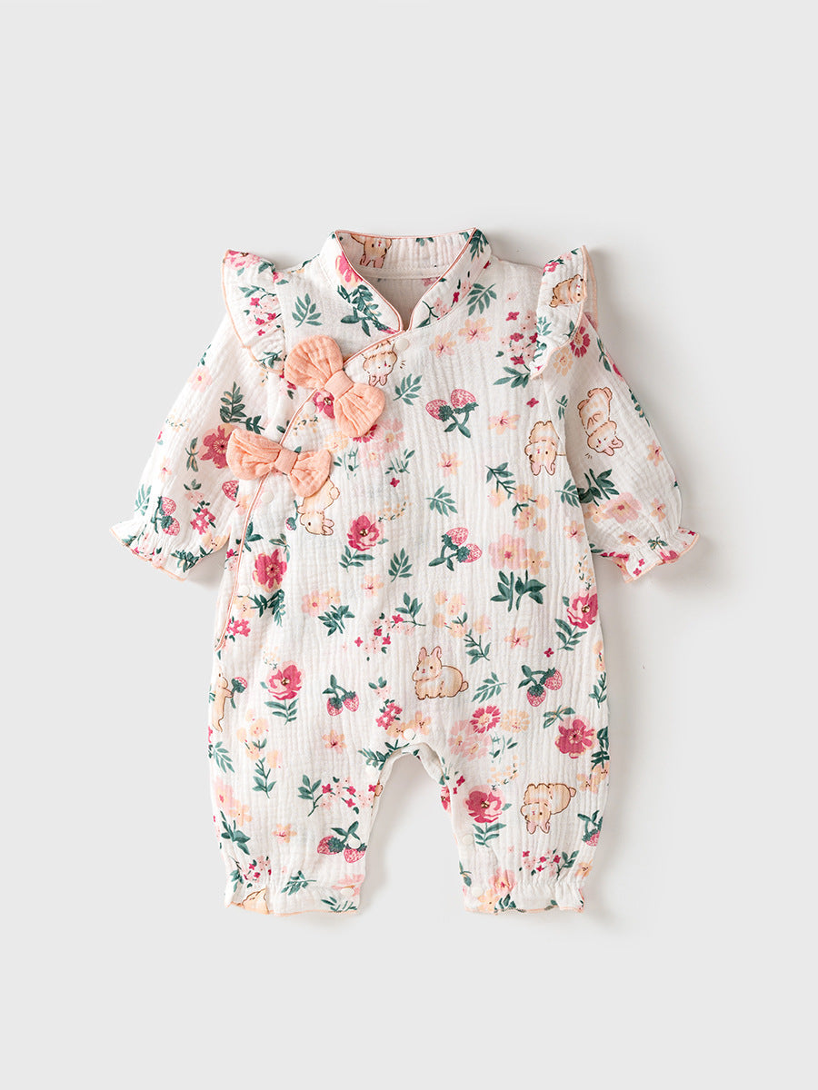 Floral baby romper with rabbits and flowers on a light gray background