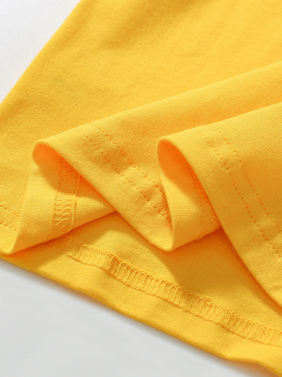 Close-up of yellow fabric with visible texture on a white background