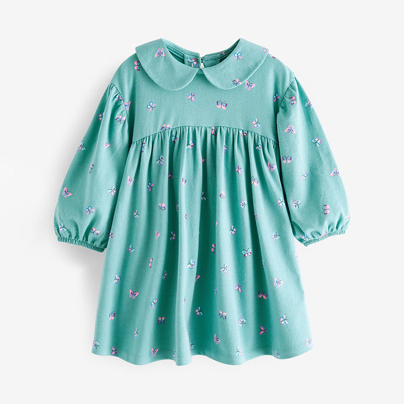Green dress with butterfly pattern on a white background