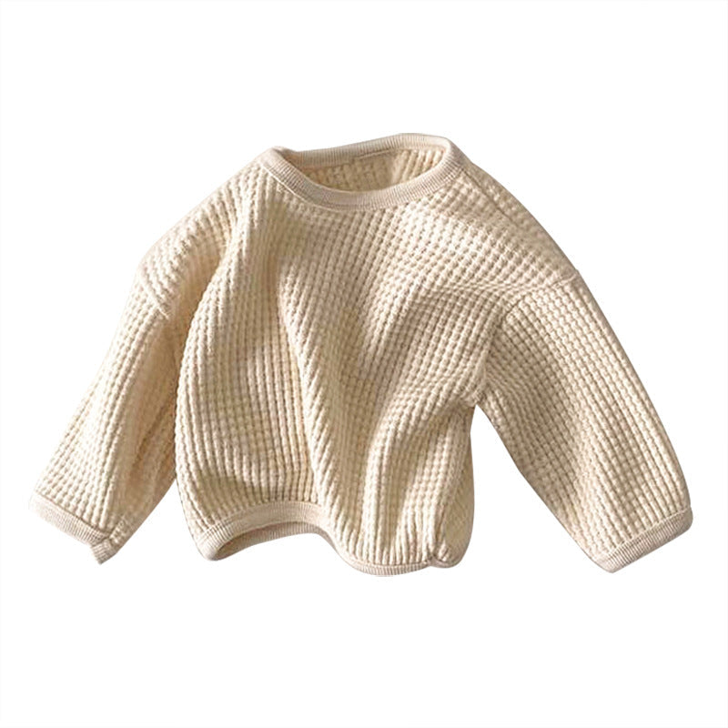 Beige knitted sweater on a white background