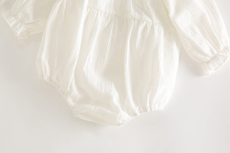White baby bloomers on a light gray background