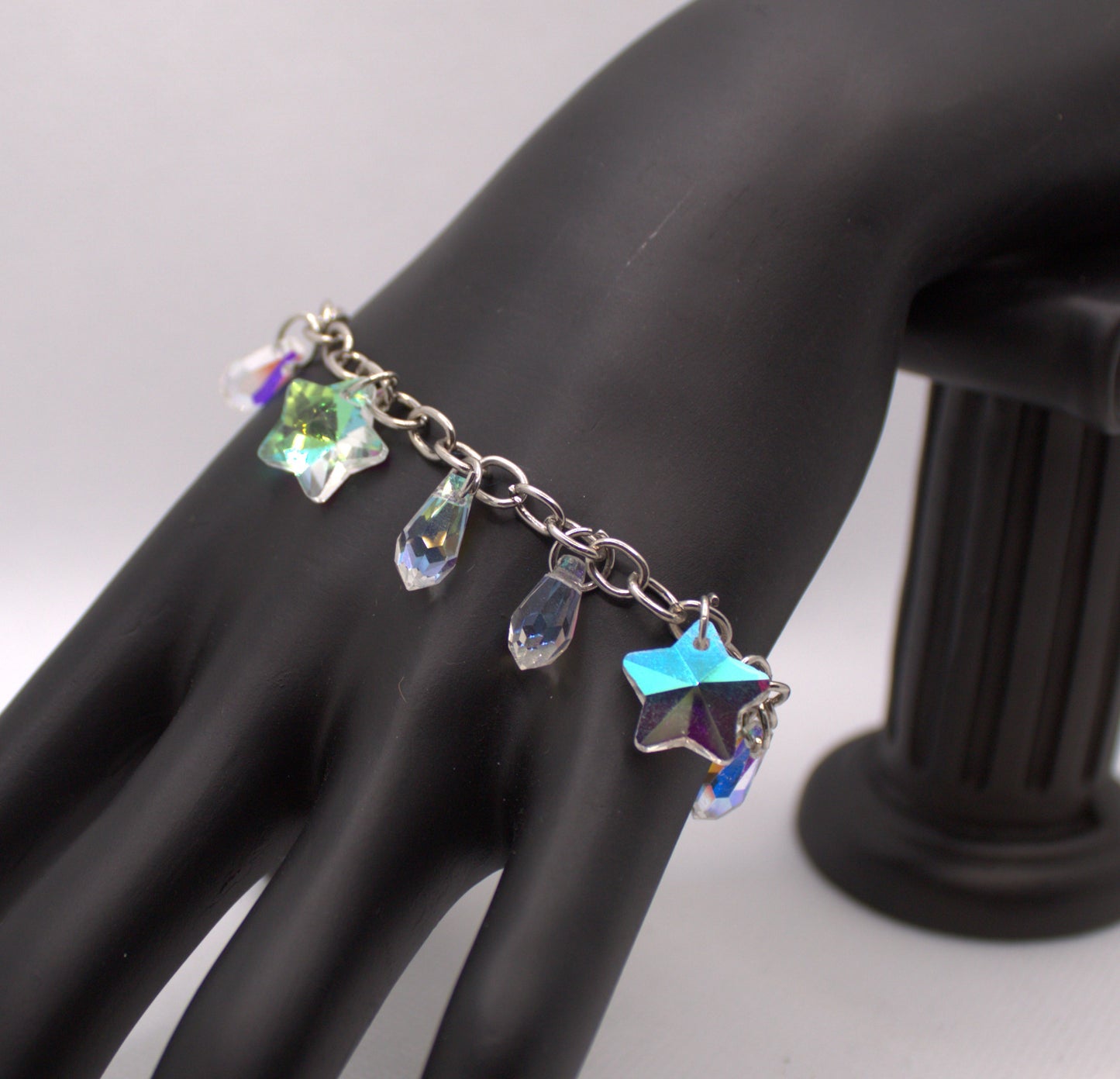 Iridescent Crystal Charm Bracelet with Star and Teardrop Accents