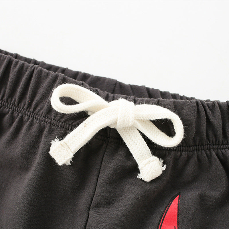 Black shorts with a white drawstring on a white background