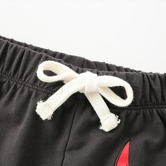 Black shorts with a white drawstring on a white background