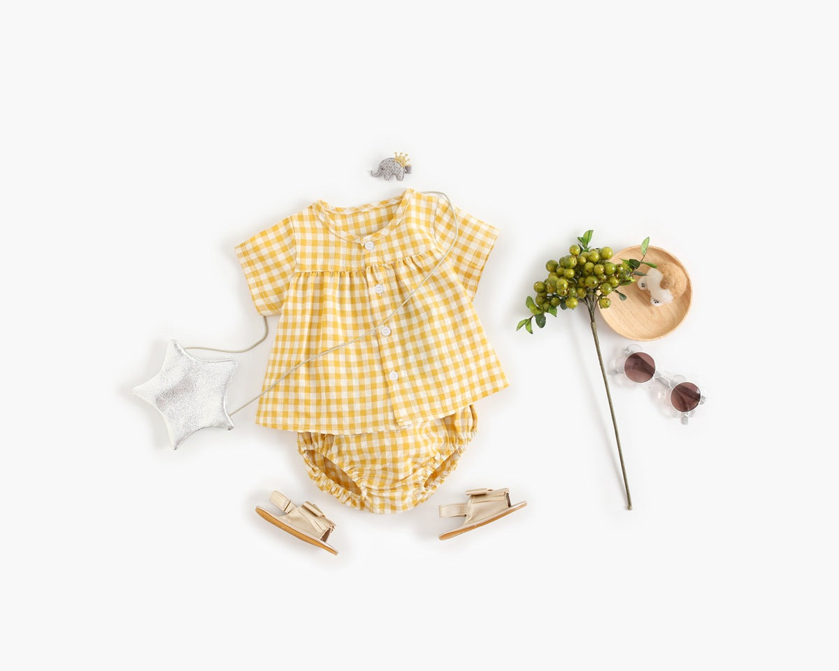 Yellow checkered outfit with accessories on a white background