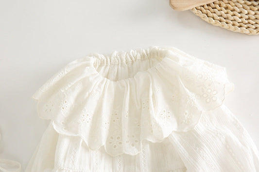 White lace petticoat on a light wooden surface