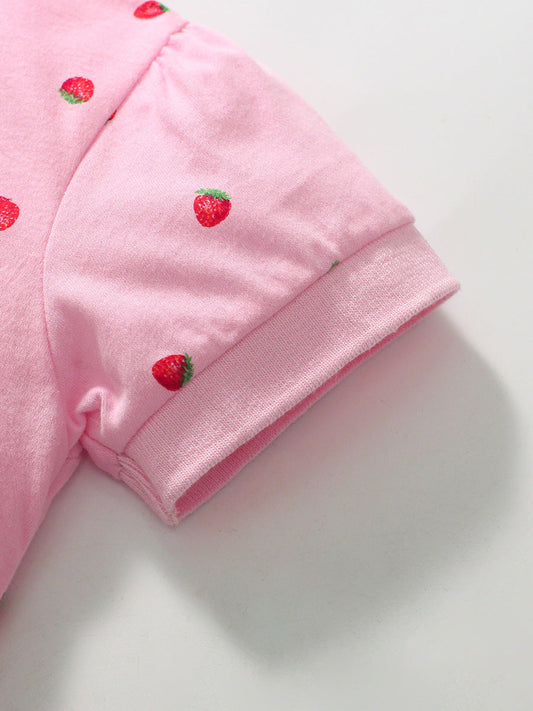 Pink shirt with strawberry patterns on a white background
