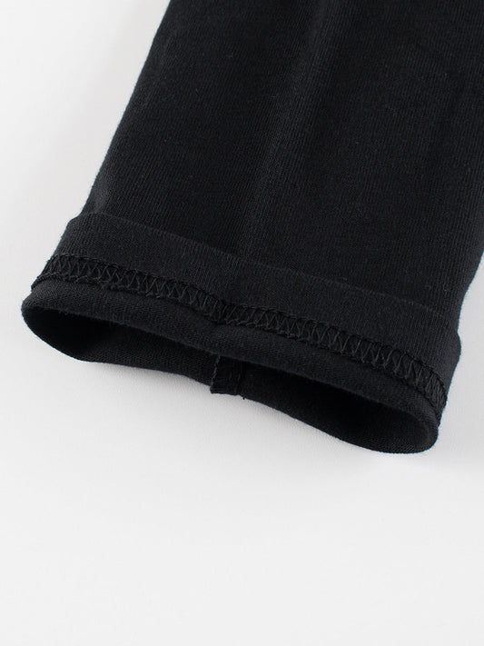 Close-up of a black fabric edge on a white background