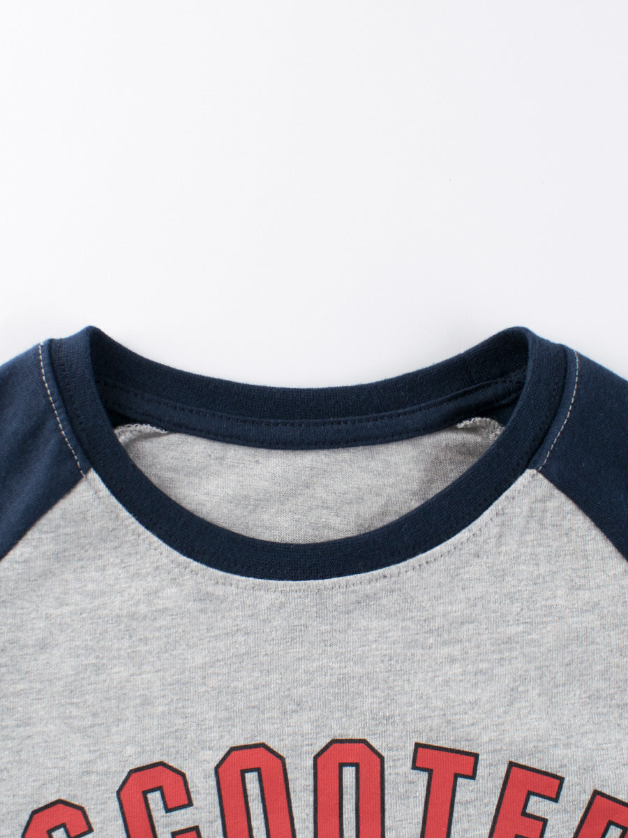 Gray sweatshirt with navy sleeves and red text on a white background