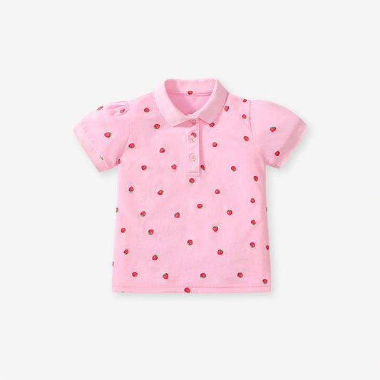 Pink polo shirt with red strawberry pattern on a white background