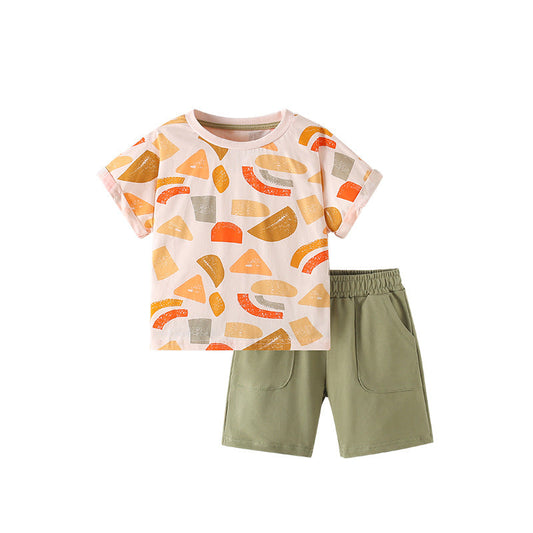 Children's outfit with a colorful geometric-patterned shirt and green shorts on a white background