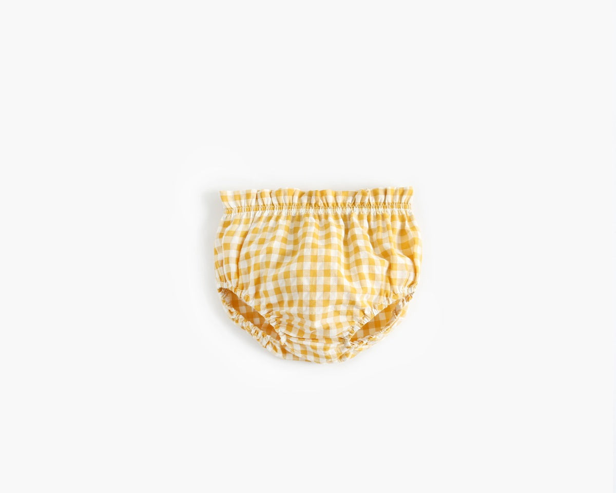 Yellow checkered baby bloomers on a white background