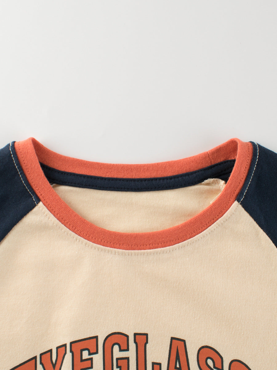 Close-up of a shirt with red and navy collar on a light background
